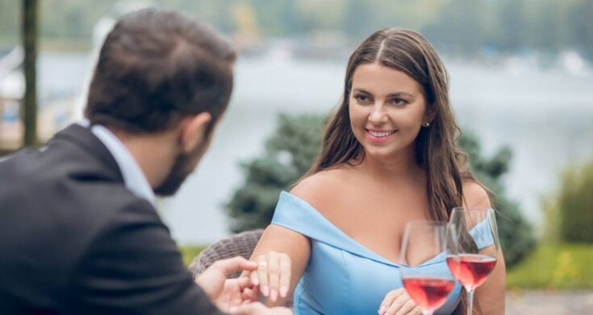 Two professionals enjoying a refined date outdoors